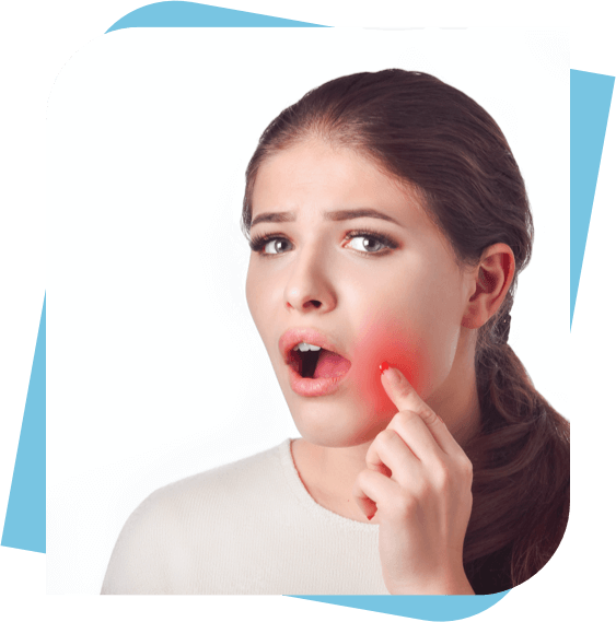 Woman pointing to her cheek which is highlighted red to show pain.