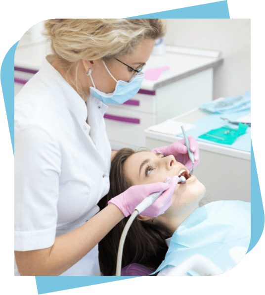 Young woman getting a filling at the dentist.