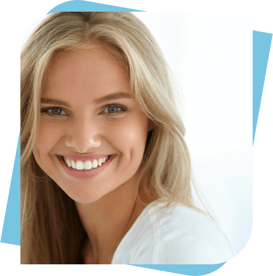 Blonde woman smiling with bright white teeth.