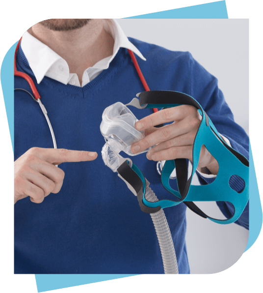 Dentist holding a sleep apnea mask