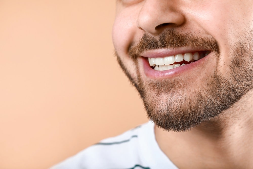 man smiling after cosmetic dentistry