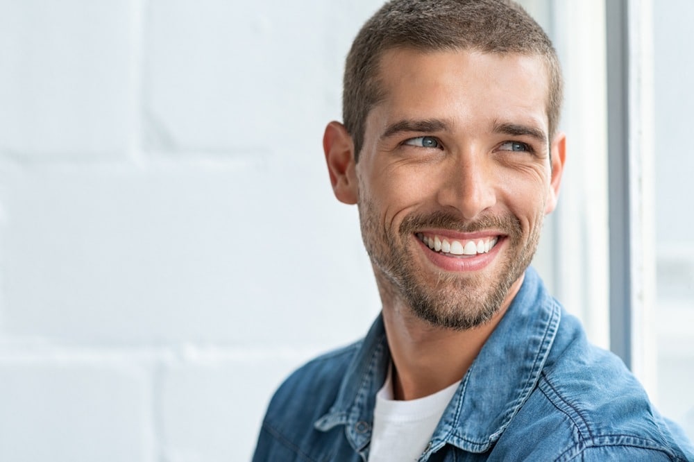 man smiling with good oral hygiene