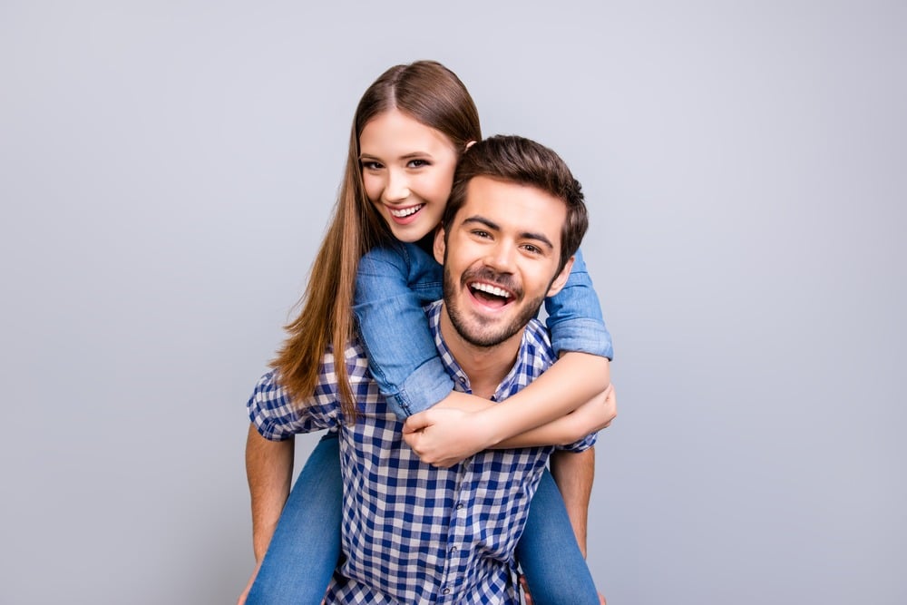 couple smiling thanks to proper dental hygiene