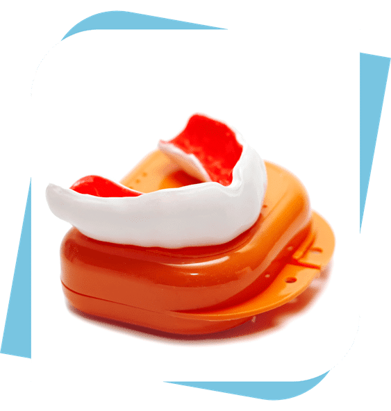 An orange and white mouthguard on top of a closed orange case