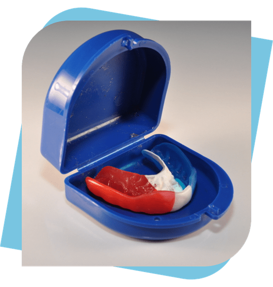 A red, white and blue mouthguard in a blue case.