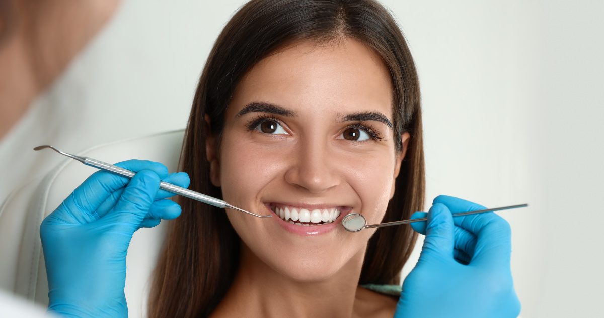 young lady smiling while in the dental office